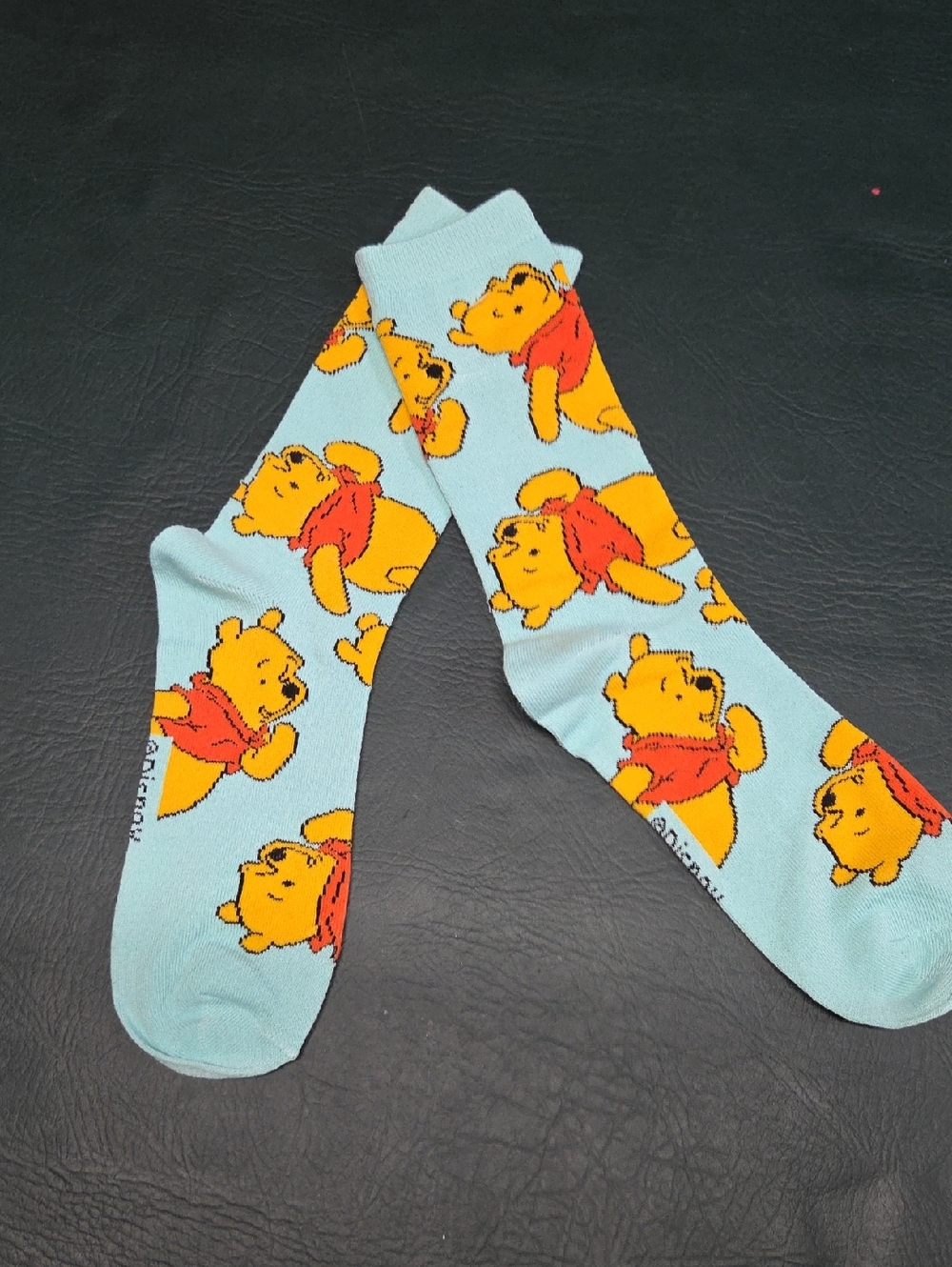 **Disney Light Blue Winnie the Pooh Crew Socks with Yellow & Red Print**